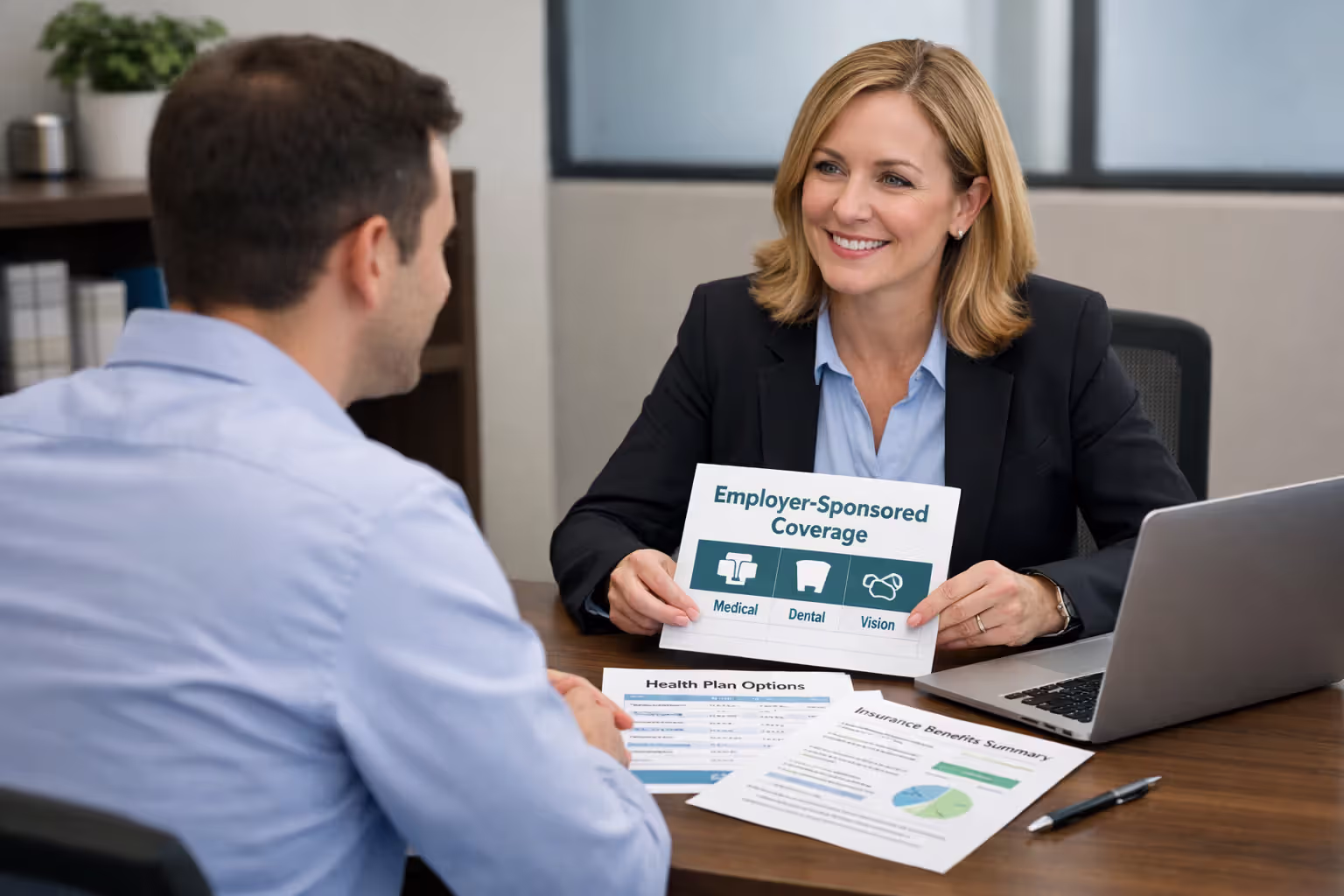 Employee discussing employer health insurance benefits with HR representative